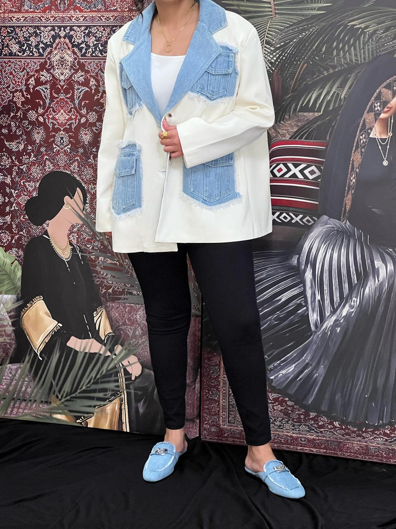 Cream jacket with denim pockets