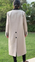Beige long blazer with black stitching