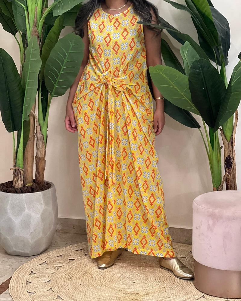Yellow sleeveless patterned dress