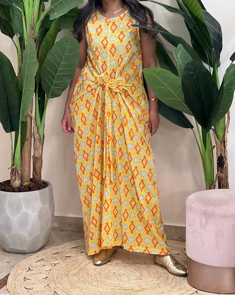 Yellow sleeveless patterned dress