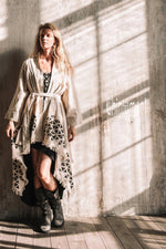 Asymmetric beige and black cardigan