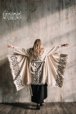 Asymmetric beige and black cardigan