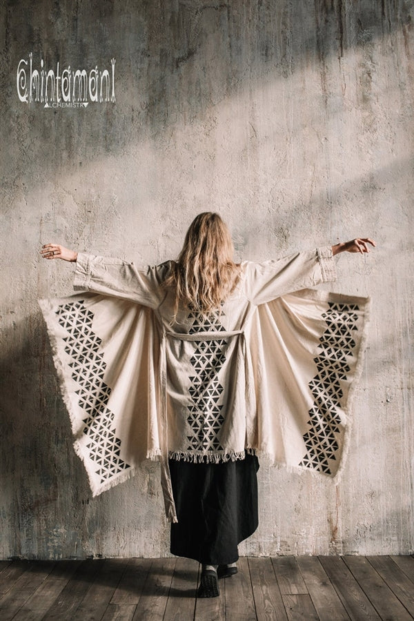 Asymmetric beige and black cardigan